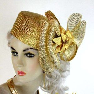 <META NAME="DESCRIPTION" CONTENT="Metallic Gold Cocktail Pillbox Hat Headpiece For Women. This Dress Hat Is Custom Made By Women's Designer Hats. We Specialize In Wedding Hats